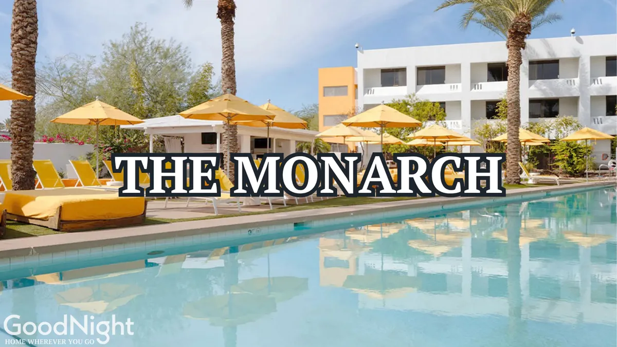 A resort-style swimming pool surrounded by sun loungers and bright yellow umbrellas, framed by swaying palm trees and a modern building facade. The scene radiates a carefree, vacation-like ambiance perfect for relaxing or socializing by the water.